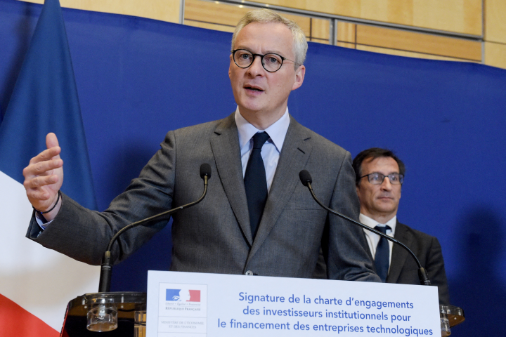French Economy and Finance Minister Bruno Le Maire speaks as finance professor Philippe Tibi listens during a press conference - Photo by ERIC PIERMONT / AFP

