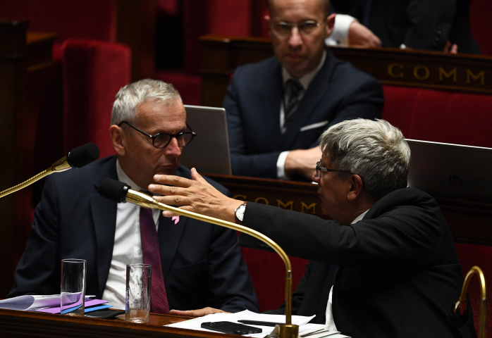 Jean-René Cazeneuve et Eric Coquerel  (Photo by Christophe ARCHAMBAULT / AFP)