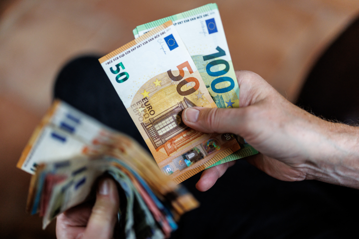 Euro banknotes in hand - Cash